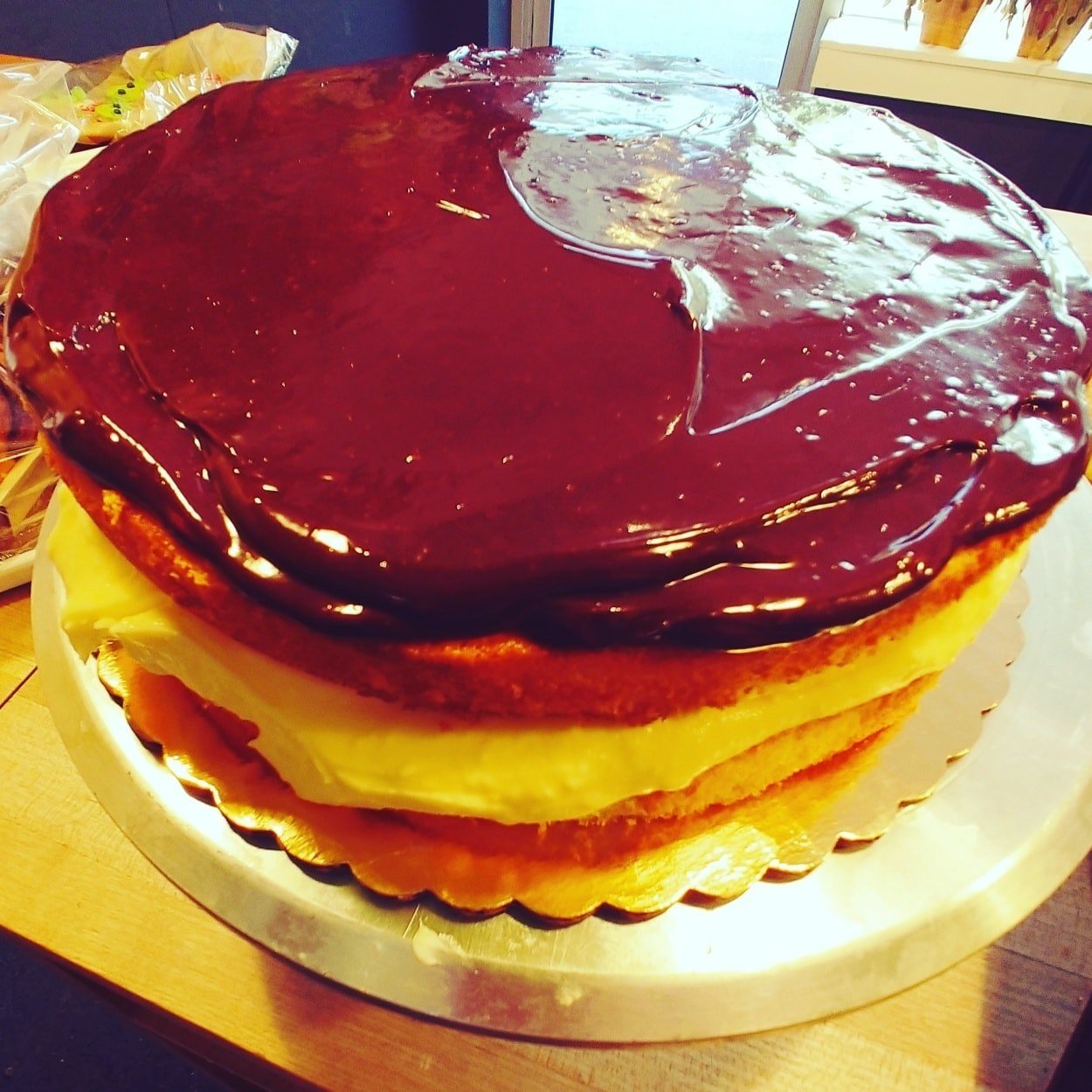Homemade Boston Cream Pie. Two layers of golden sponge cake, sandwiched with thick vanilla pastry cream. And of course, topped with a rich dark chocolate glaze.