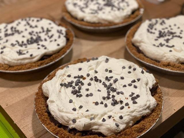 Very rich homemade chocolate cream pie. Made with multiple types of chocolate so you get the most decadent pie imaginable. Topped with real whipped cream.  Made with a graham cracker crust.